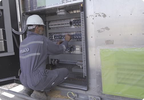 PESCO electrician wiring a switchgear panel