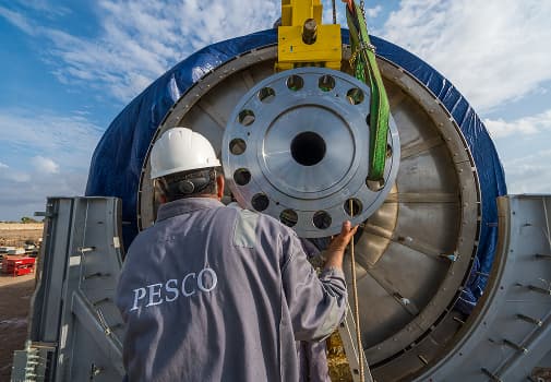 PESCO technician guiding a vessel flange into place