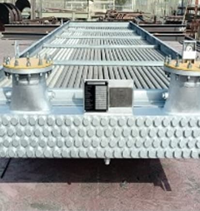 A finned-tube heat exchanger bundle in the yard