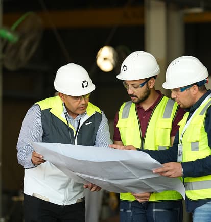 PESCO engineers reviewing a drawing in the workshop