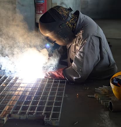 A Prime Star welder working on steel grating