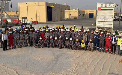 The Prime Star workforce assembled on site in hard hats and coveralls